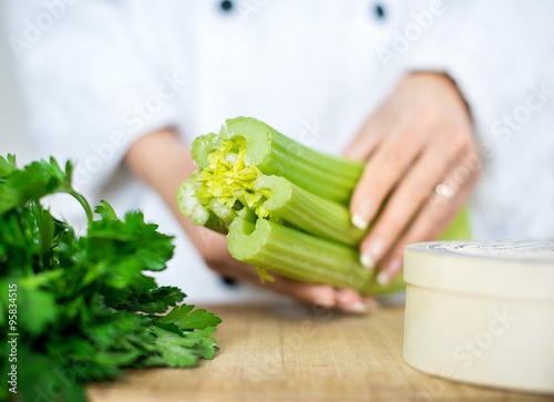 chef holding celery