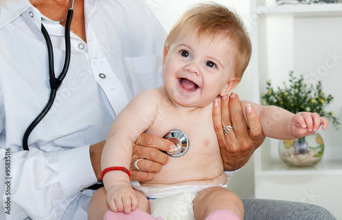 Female doctor pediatrician and patient happy child baby 