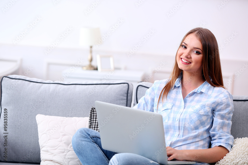 Young beautiful woman with laptop at home Young beautiful woman with laptop at home