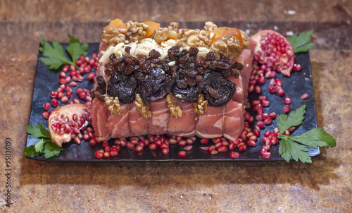 raw pork with prune nuts and pomegranate