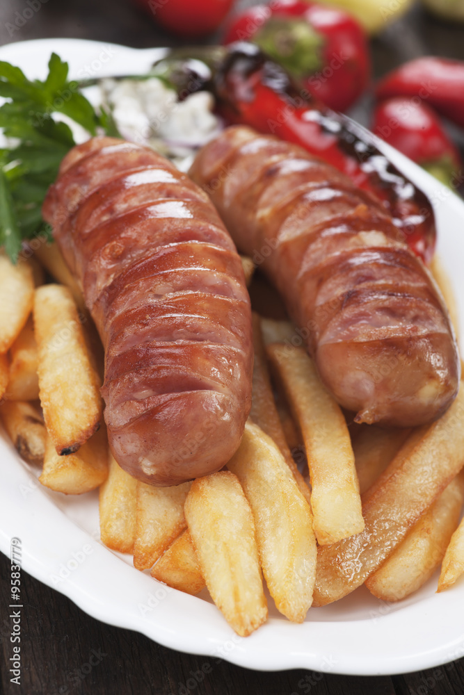 Grilled sausage and french fries Grilled sausage and french fries