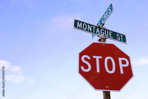 Red stop sign on the corner