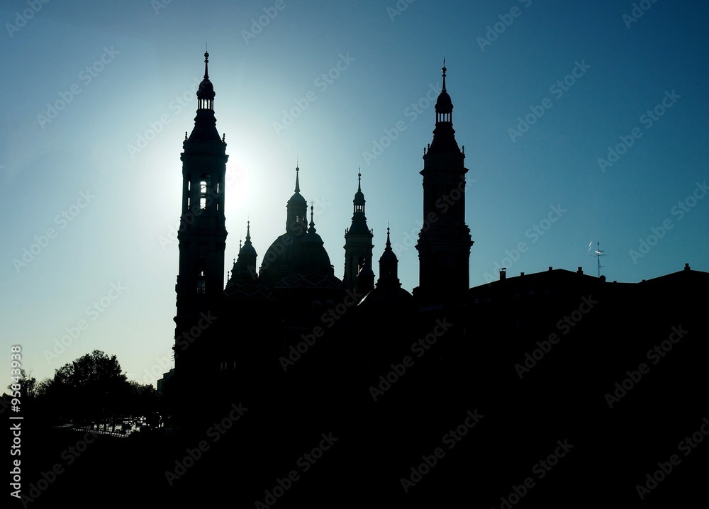 Silhouette of Basilica of Our Lady of the Pillar in Zaragoza in Spain, with one of the main towers having the halo effect