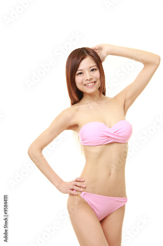 Japanese woman posing in a pink bikini