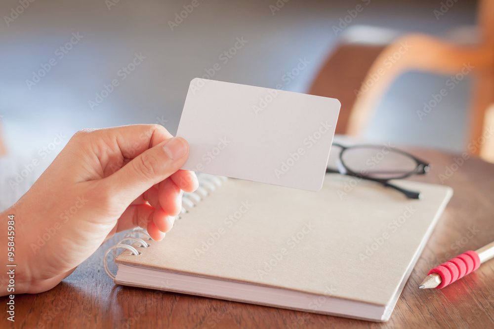 Woman hold blank business cards Woman hold blank business cards
