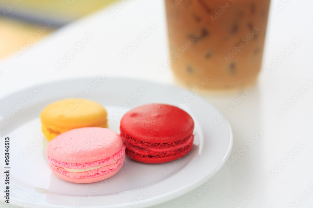 Sweet and colourful french macarons on white table
