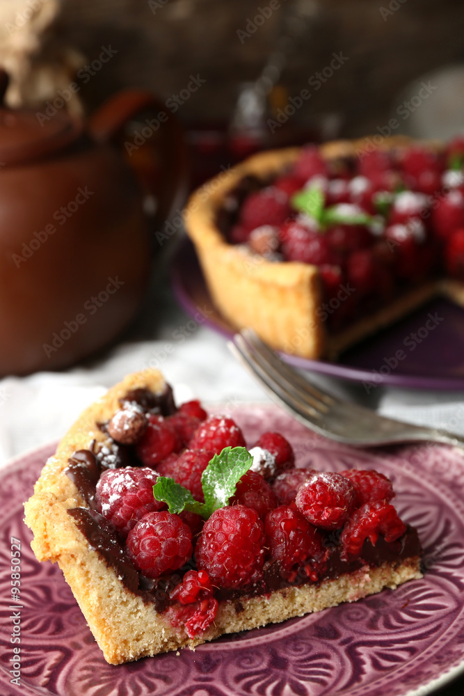 Piece of tart with fresh raspberries, on wooden background Piece of tart with fresh raspberries, on wooden background