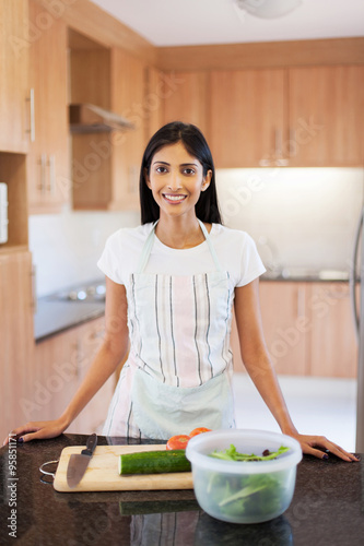 young indian woman in home kitchen