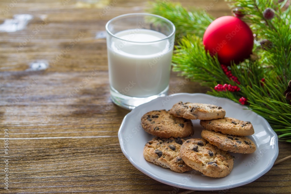 Cookies and milk for Santa Clause on wood background Cookies and milk for Santa Clause on wood background