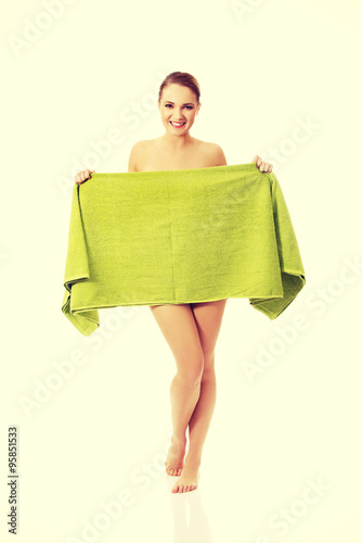 Spa woman covering herself with a towel.