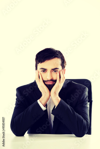 Businessman sitting at the desk.