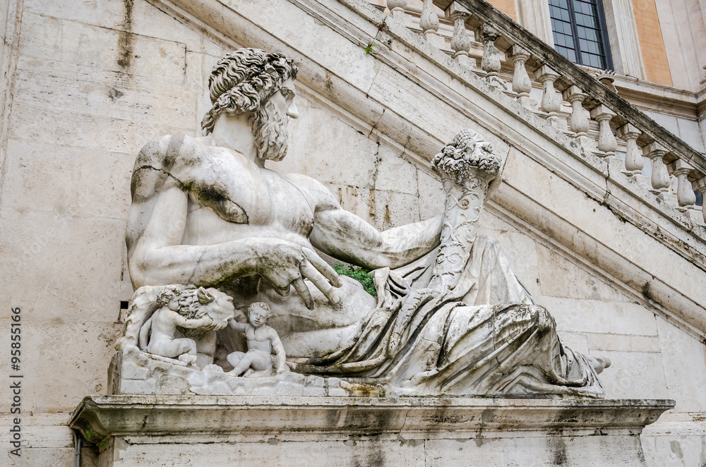 Statue on the fountain in the square del Campidoglio of Rome, capital of Italy