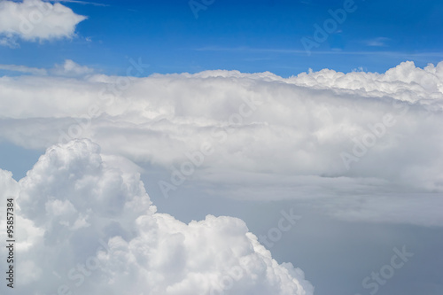 Blue Sky and White clouds blur. Airplane view from the window