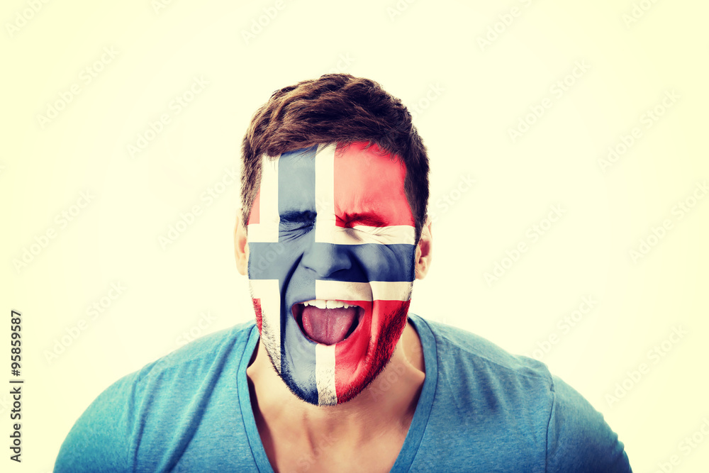 Screaming man with Norway flag on face. Screaming man with Norway flag on face.