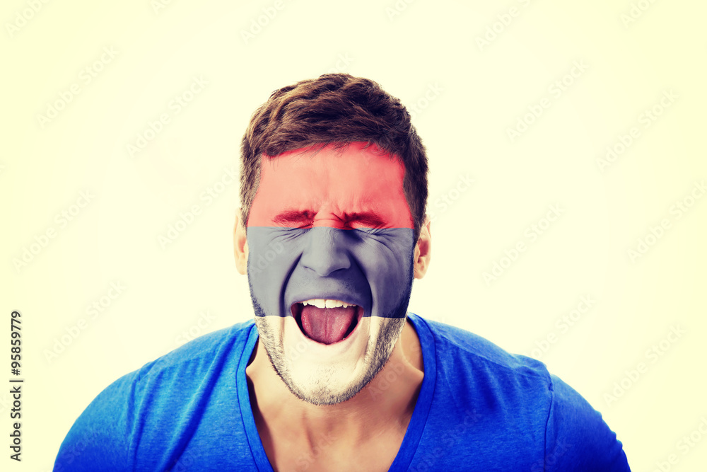 Screaming man with Serbia flag on face.