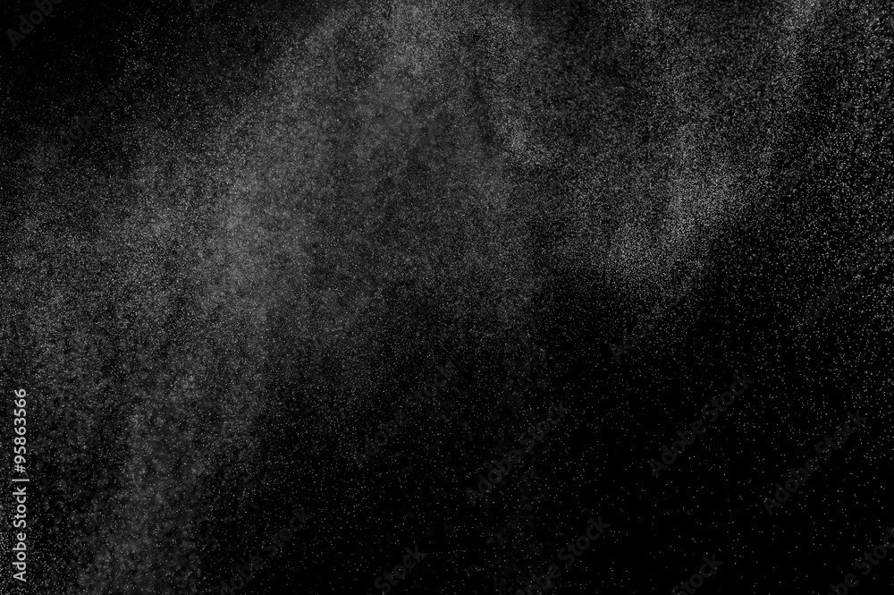 abstract splashes of water on a black background. splashes of milk. abstract spray of water. abstract rain. shower water drops.  white dust explosion. abstract texture. abstract black background..