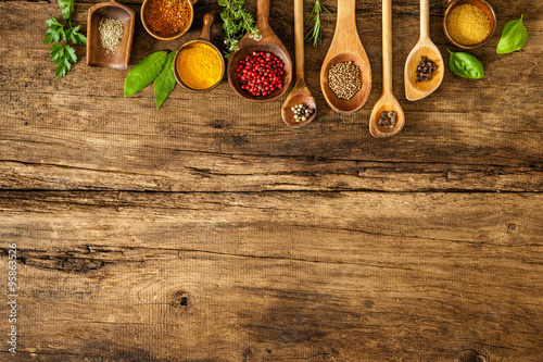 Colorful spices on wooden table