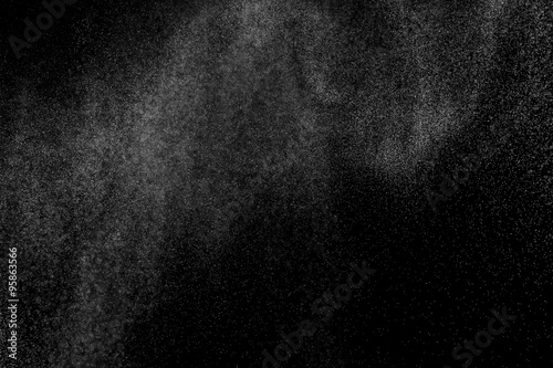 abstract splashes of water on a black background. splashes of milk. abstract spray of water. abstract rain. shower water drops. white dust explosion. abstract texture. abstract black background..