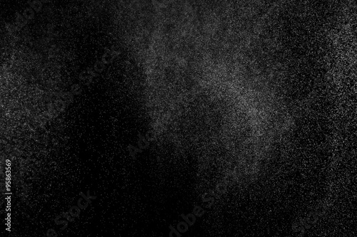 abstract splashes of water on a black background. splashes of milk. abstract spray of water. abstract rain. shower water drops. white dust explosion. abstract texture. abstract black background..