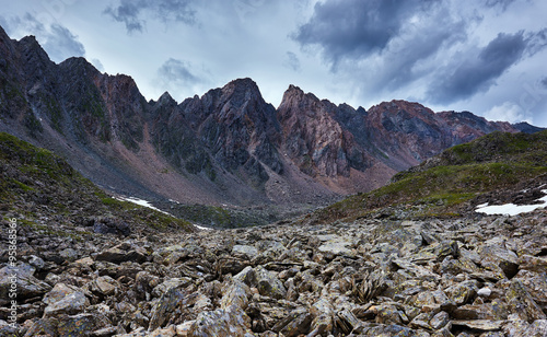 Sharp fragments of rock on background of a mountain range. Eastern Sayan. The Republic of Buryatia