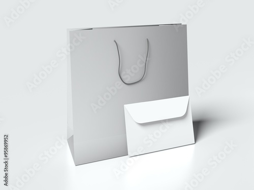 Light gray paper bag with handles and white cardboard sleeve on white background. mock up