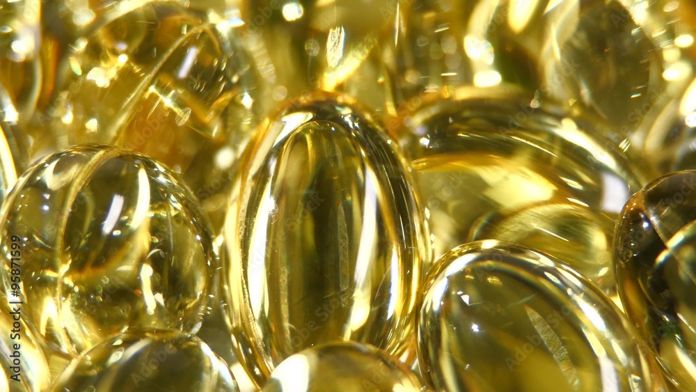 Omega 3 fish oil capsules, rotation, macro, close up Omega 3 fish oil capsules, rotation, macro, close up