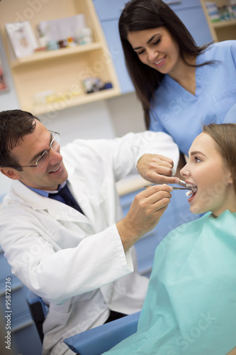 Dentist prepare his client for repairing tooth