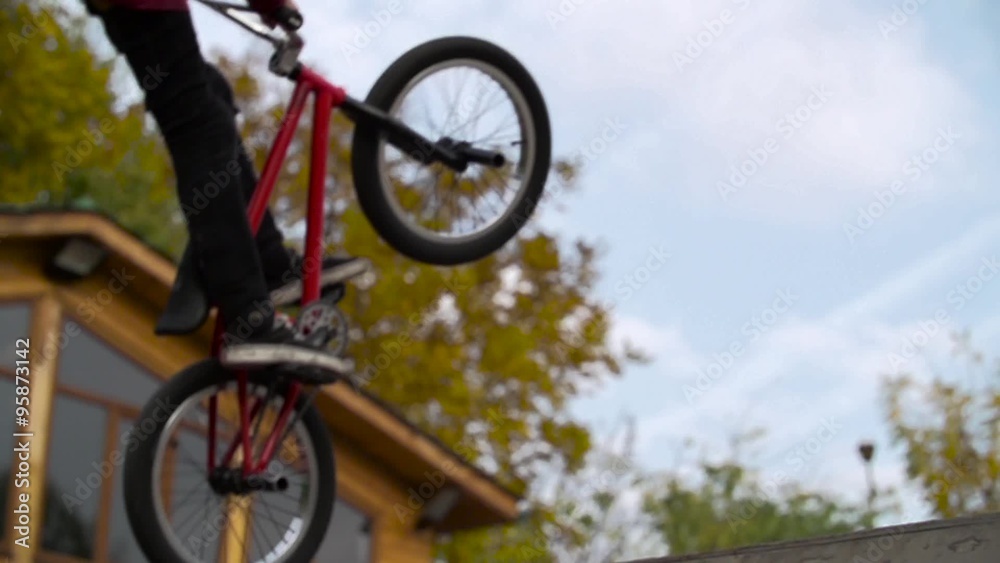 Silhouette of jumper, performing BMX mountain bike sport jump. Slow Motion 400 fps Silhouette of jumper, performing BMX mountain bike sport jump. Slow Motion 400 fps