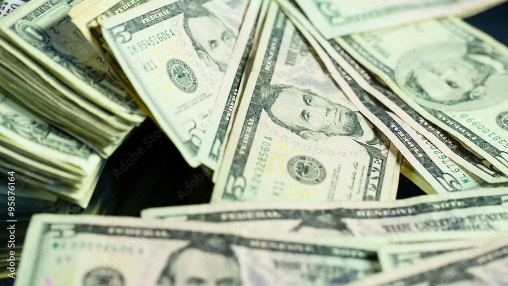 Move Over Stack of Cash. camera moves over the top of a stack of cash. fives, tens and one dollar bills.
Move Over Stack of Cash. camera moves over the top of a stack of cash. fives, tens and one dollar bills.