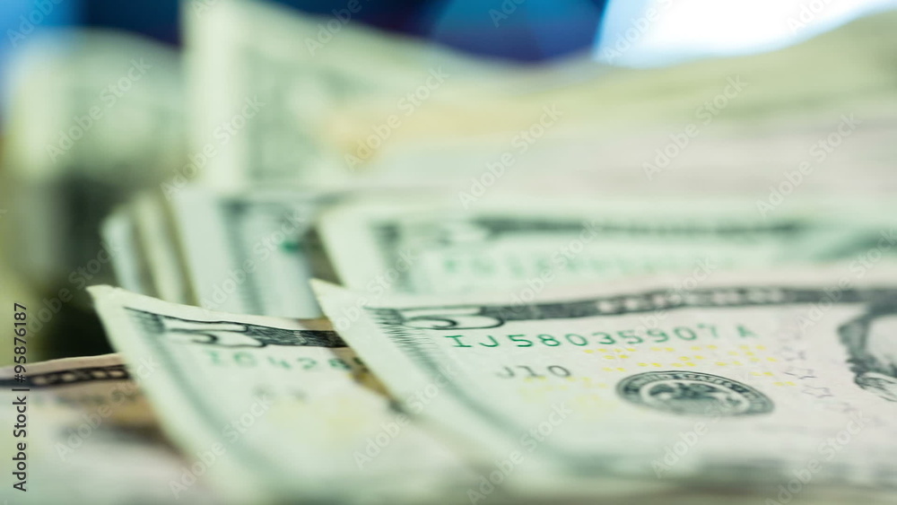 Close Up Pan on Money Stacks. 2 clips. camera dollies right on stacks of money close up. 1st clip is focused on 5 dollar bill. 2nd clip is focus on hundred dollar bill
Close Up Pan on Money Stacks. 2 clips. camera dollies right on stacks of money close up. 1st clip is focused on 5 dollar bill. 2nd clip is focus on hundred dollar bill