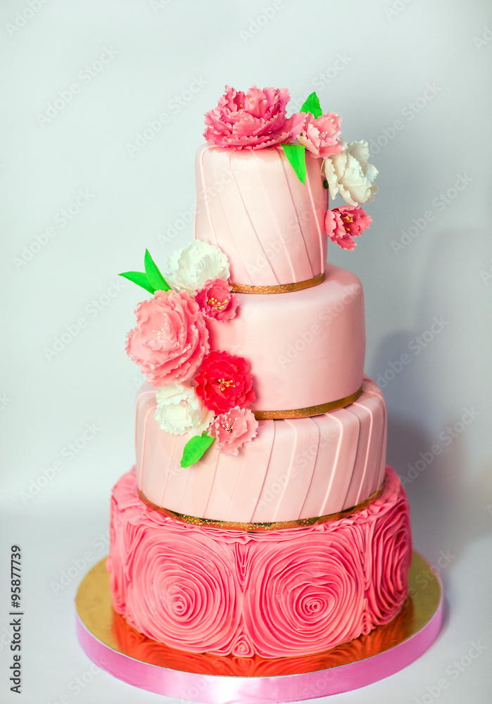 Pink wedding cake isolated on white background. Handmade Wedding Pink wedding cake isolated on white background. Handmade Wedding