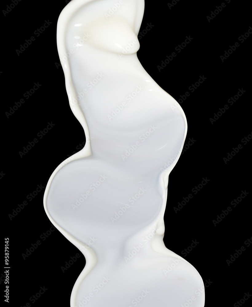 milk splash on black background milk splash on black background