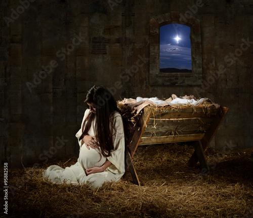 Fotografering Pregnant Mary Leaning on Manger