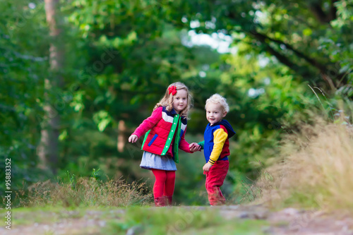 Kids hiking in autumn park