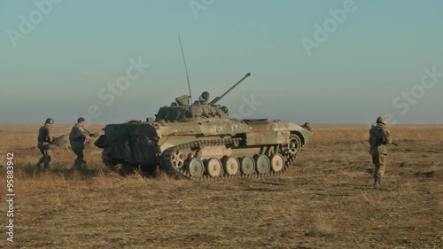 Infantry fighting vehicle on the batlefield. Military armored vehicles training photo