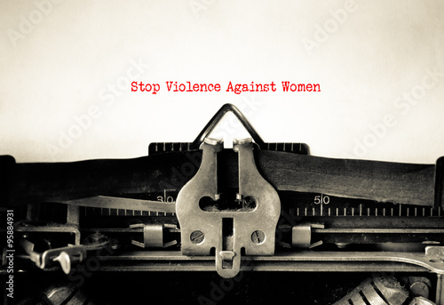 Stop violence against women written on vintage typewriter