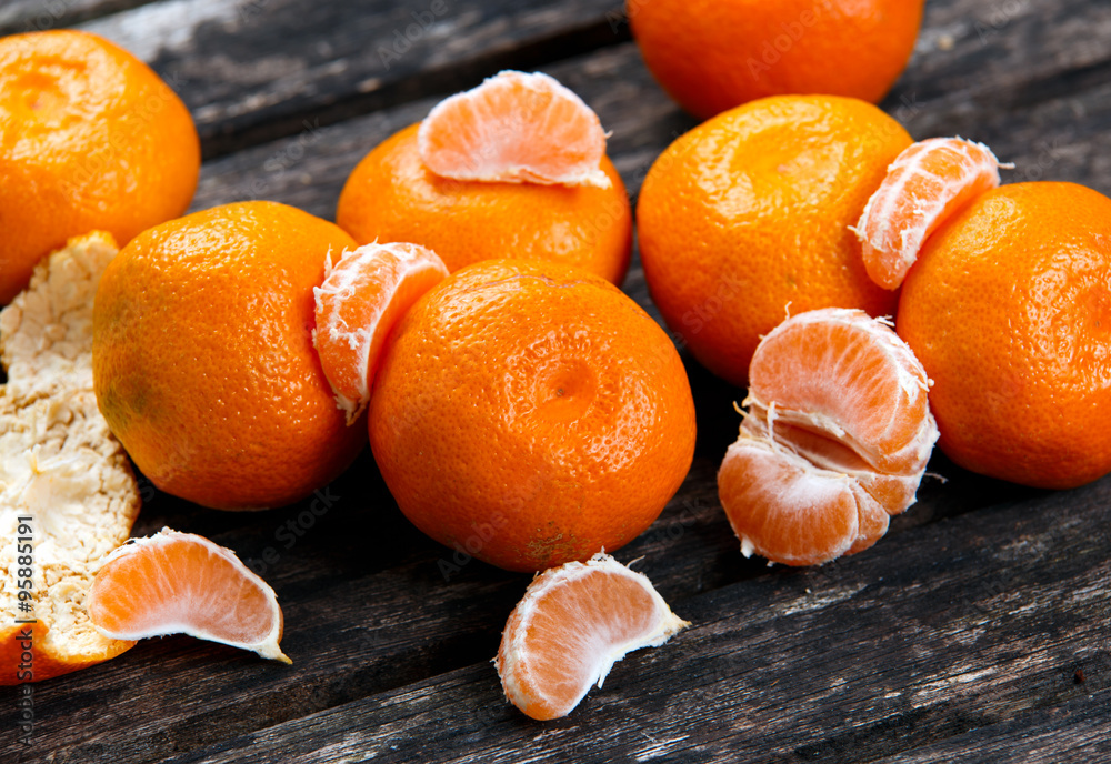 Fresh Close up Tangerines on old wooden table. Fresh Close up Tangerines on old wooden table.