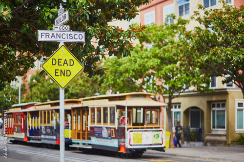 Street sign and cable cars in San Francisco