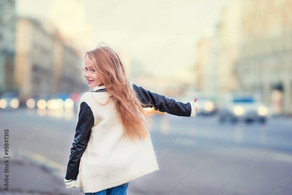 Adorable little girl get taxi outdoors in European city Adorable little girl get taxi outdoors in European city