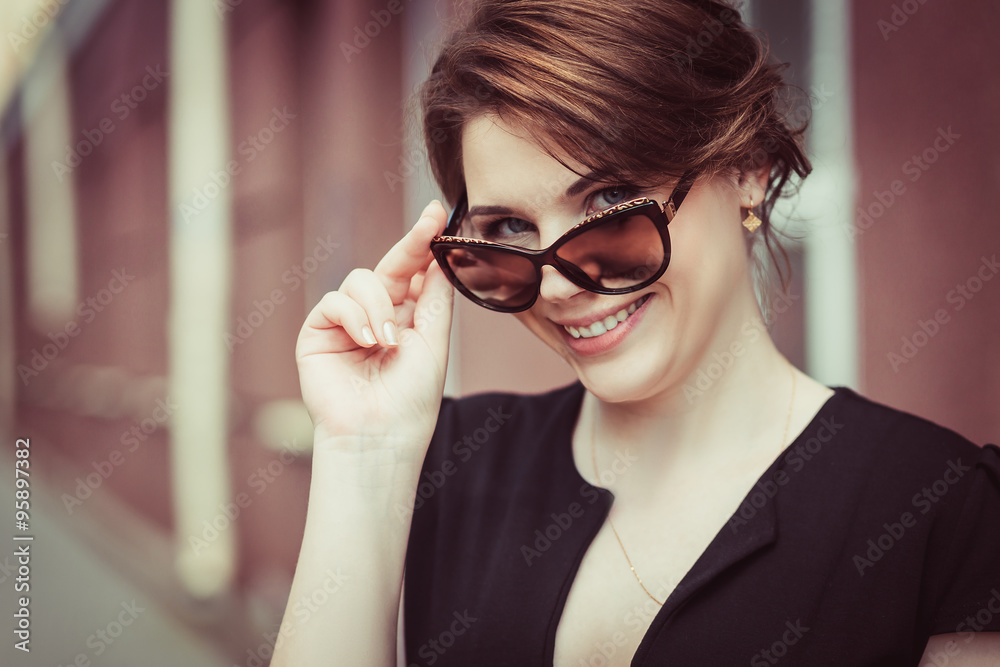 Close-up of beautiful brunette model in stylish sunglasses Close-up of beautiful brunette model in stylish sunglasses