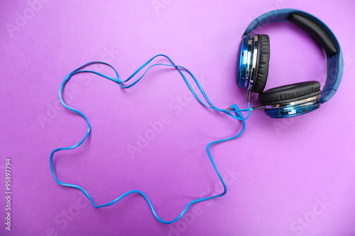 Headphones on purple background