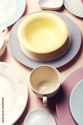 Composition of tableware on rosy background