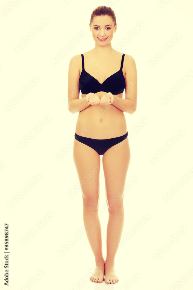 Fototapeta premium Woman in bikini with empty hands.