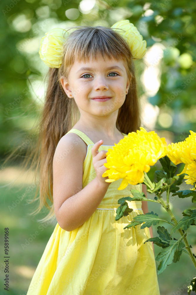 Little girl with flowers outside Little girl with flowers outside