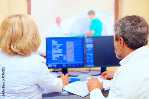 medical staff discussing mri results during procedure