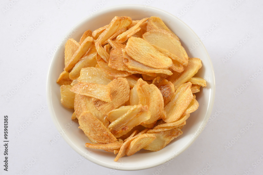 Garlic sliced and fried in oil.