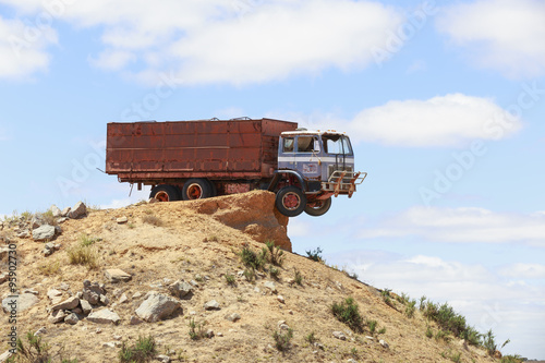 Abandoned Red Truck Parked on the Edge