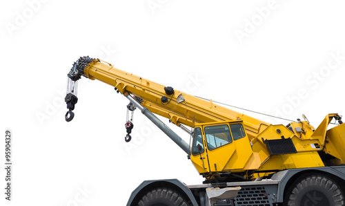 Yellow crane boom with hooks isolated on a white background photo