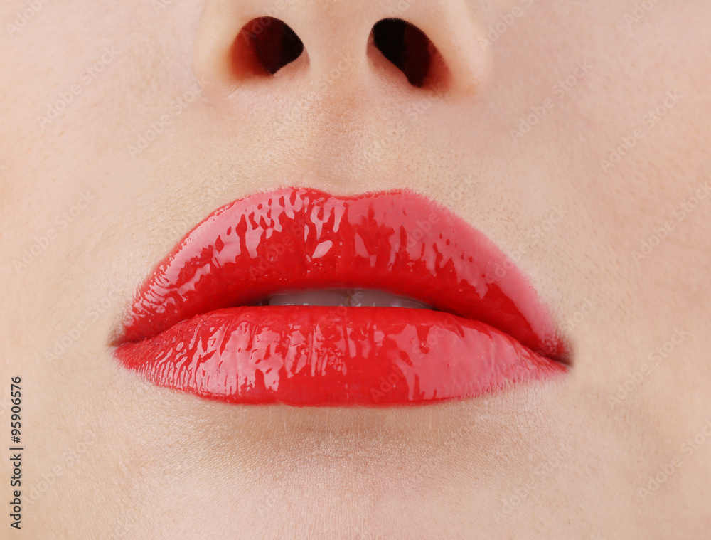 View on woman's red lips, close-up View on woman's red lips, close-up
