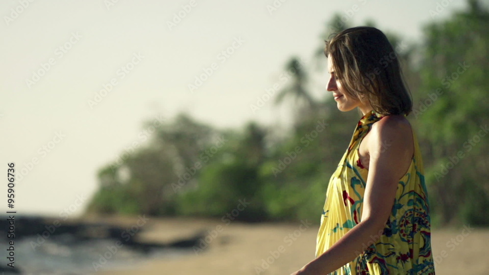 Young, happy woman walking on beach during sunset, super slow motion 240fps
Young, happy woman walking on beach during sunset, super slow motion 240fps